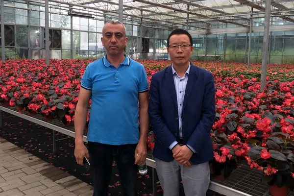 Customers attending a flower greenhouse project handover