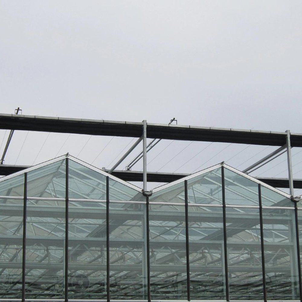 Twin-wall polycarbonate hollow sheet panels set into the grooved frame