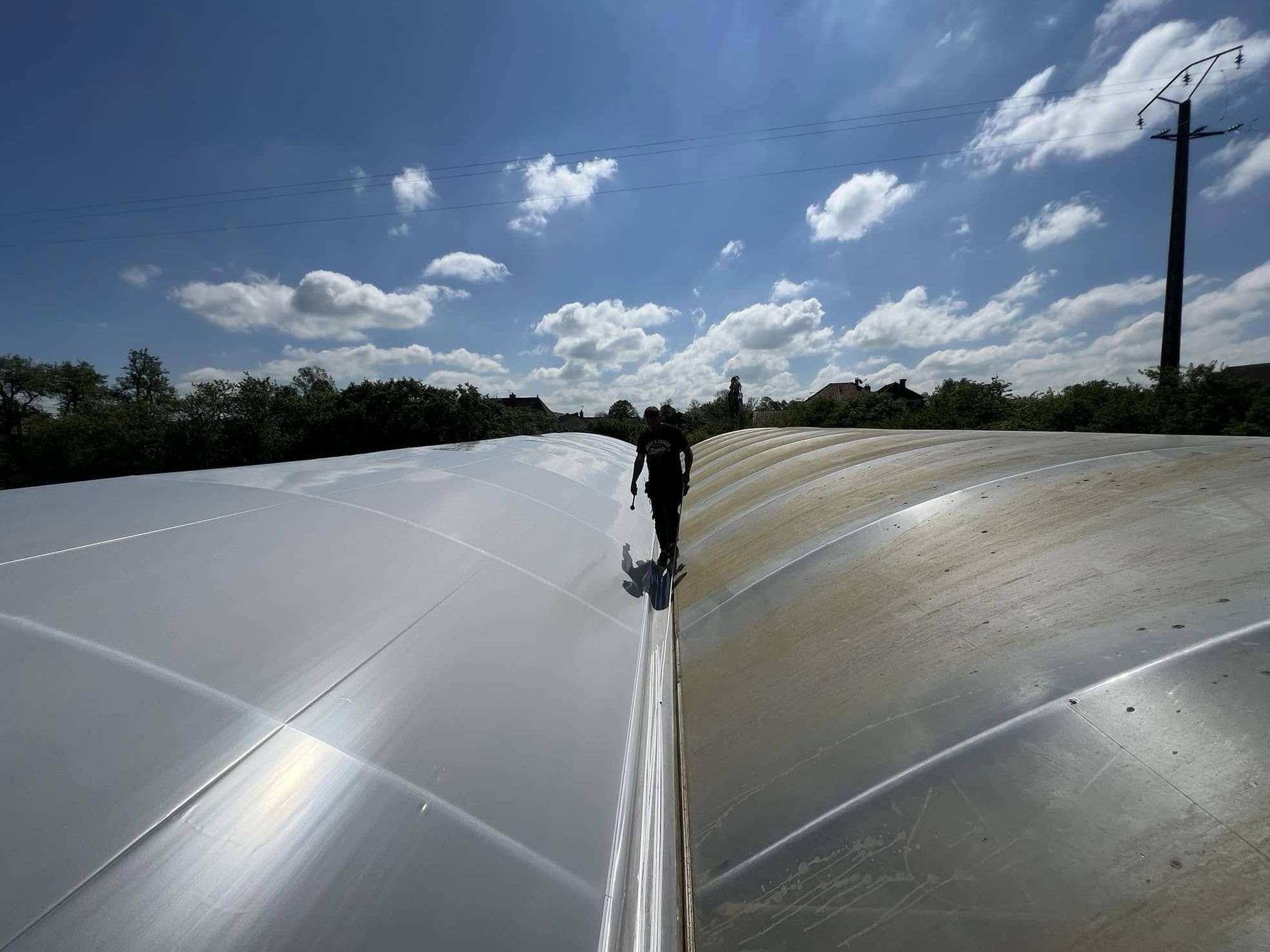 Film cover of a greenhouse with cloud visible through the sheet