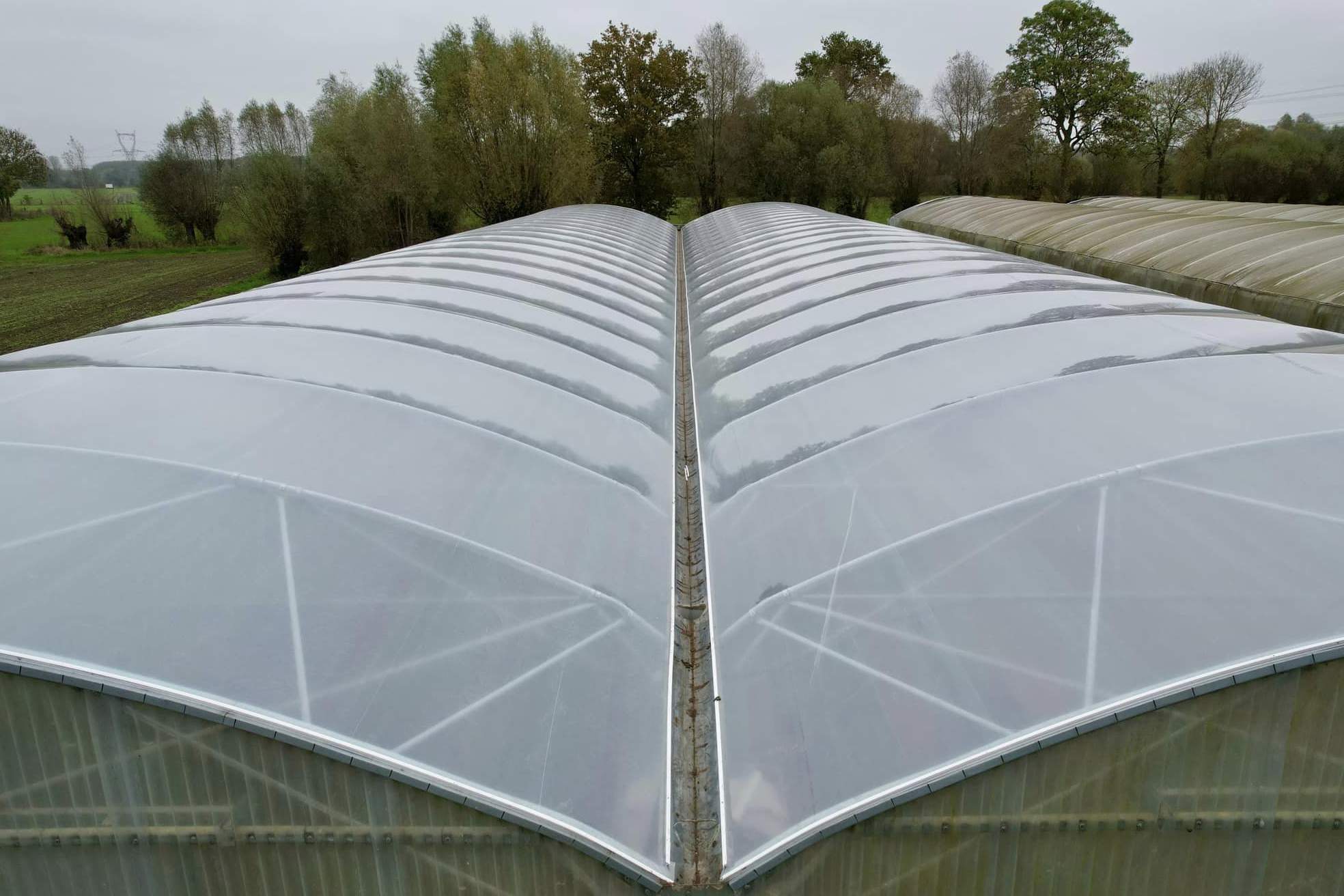 Ridge and gutter detail of a multi span plastic film greenhouse