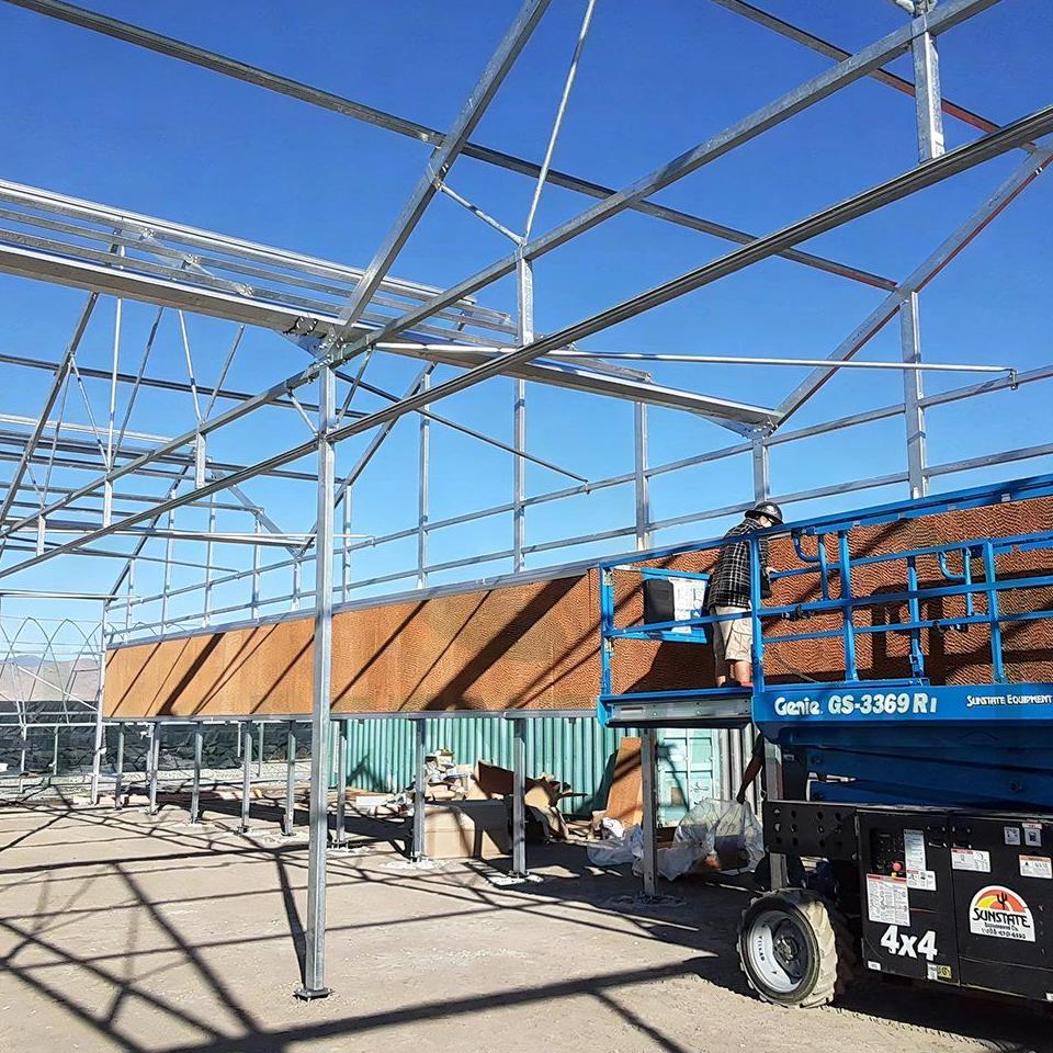 Galvanized steel frame of a film tunnel greenhouse during construction