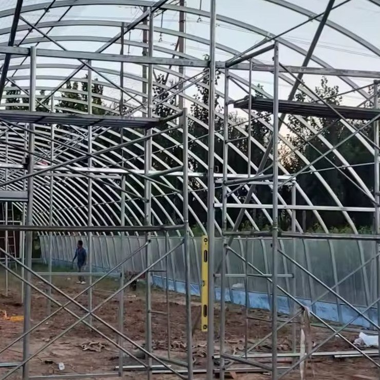 Galvanized steel arch frame of a tunnel greenhouse during construction
