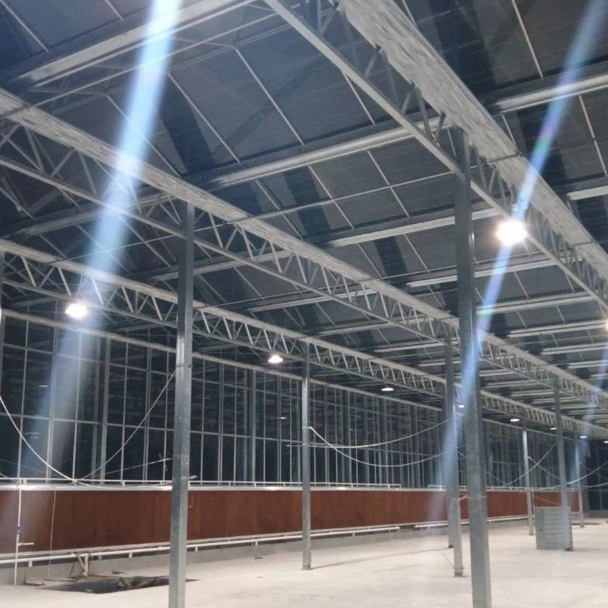 Greenhouse interior showing roof structure and installed lighting