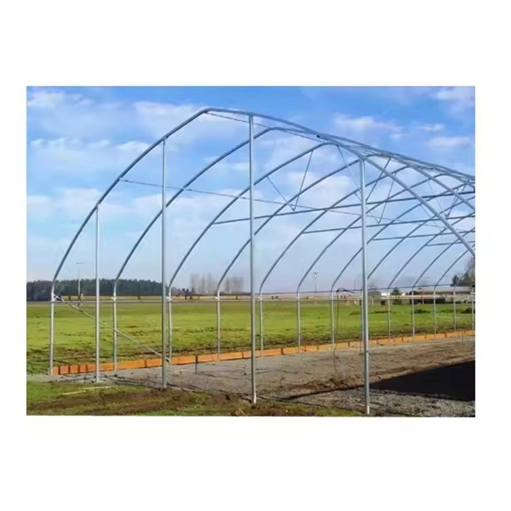 Galvanized steel pipe arch frame of a greenhouse under construction
