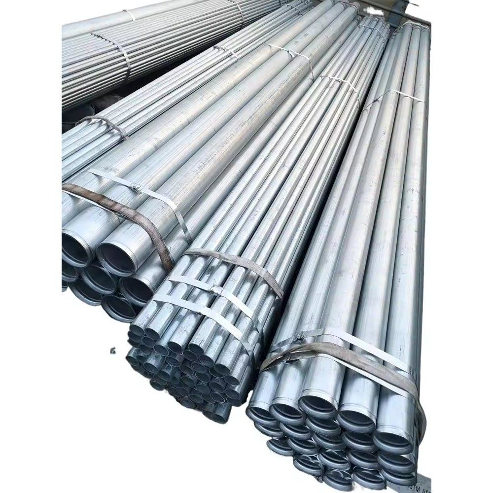 Bundles of galvanized round steel pipes tied with straps on the ground