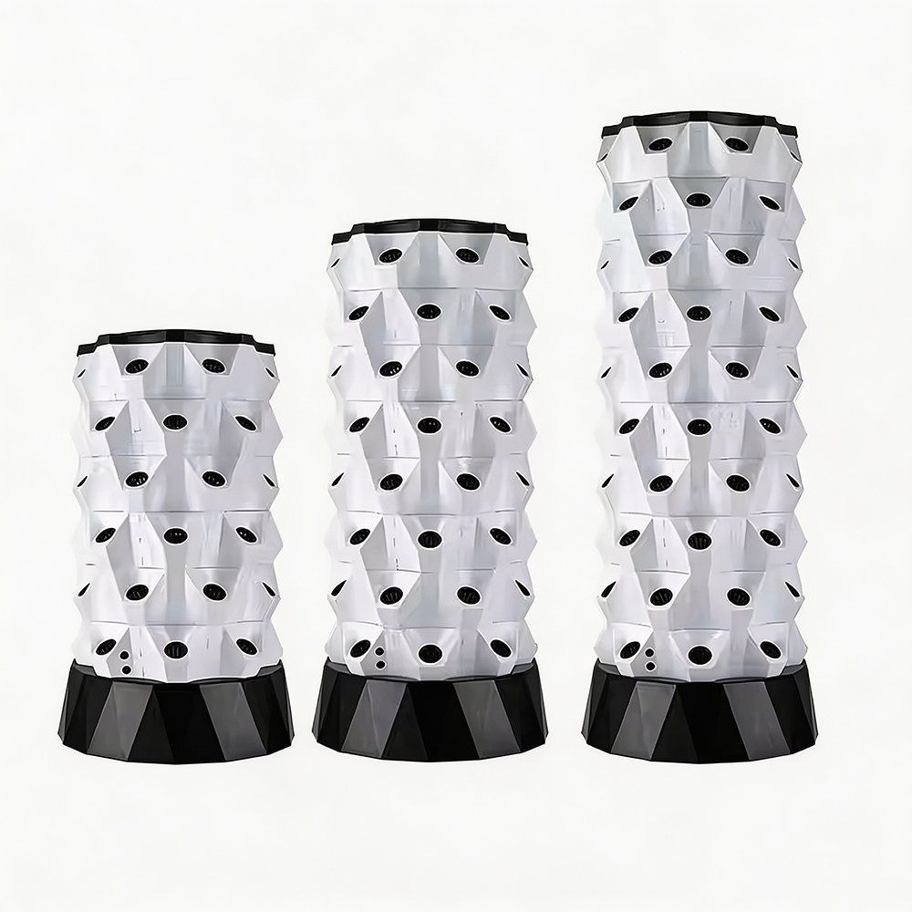 Three white hydroponic growing towers shown side by side