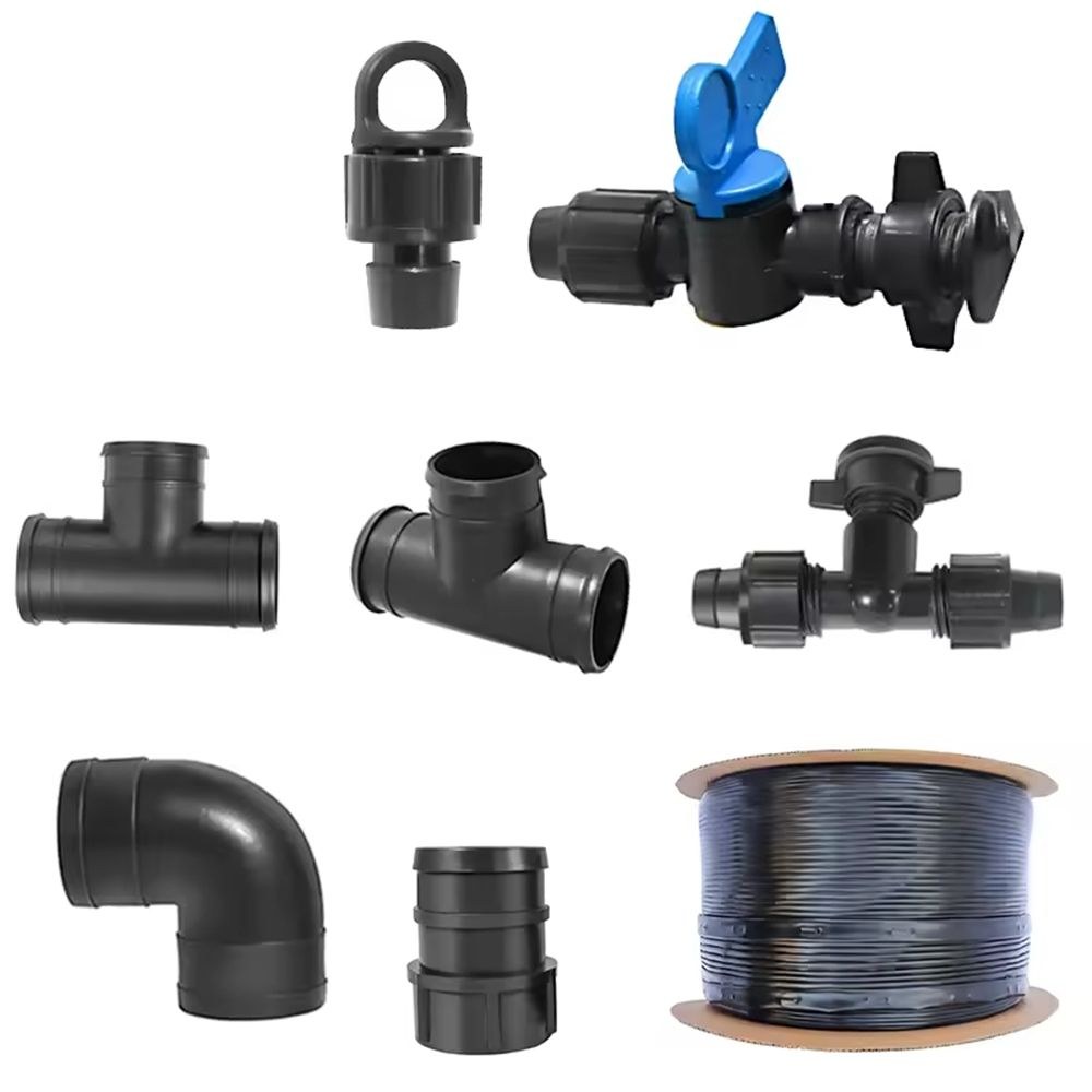 Drip irrigation fittings and a tape reel on a white background