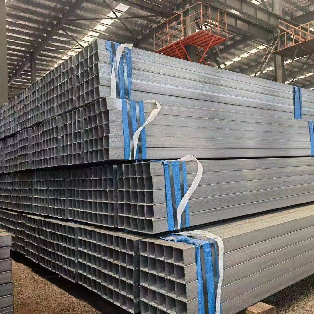 Long square galvanized tubes on racking with blue strapping