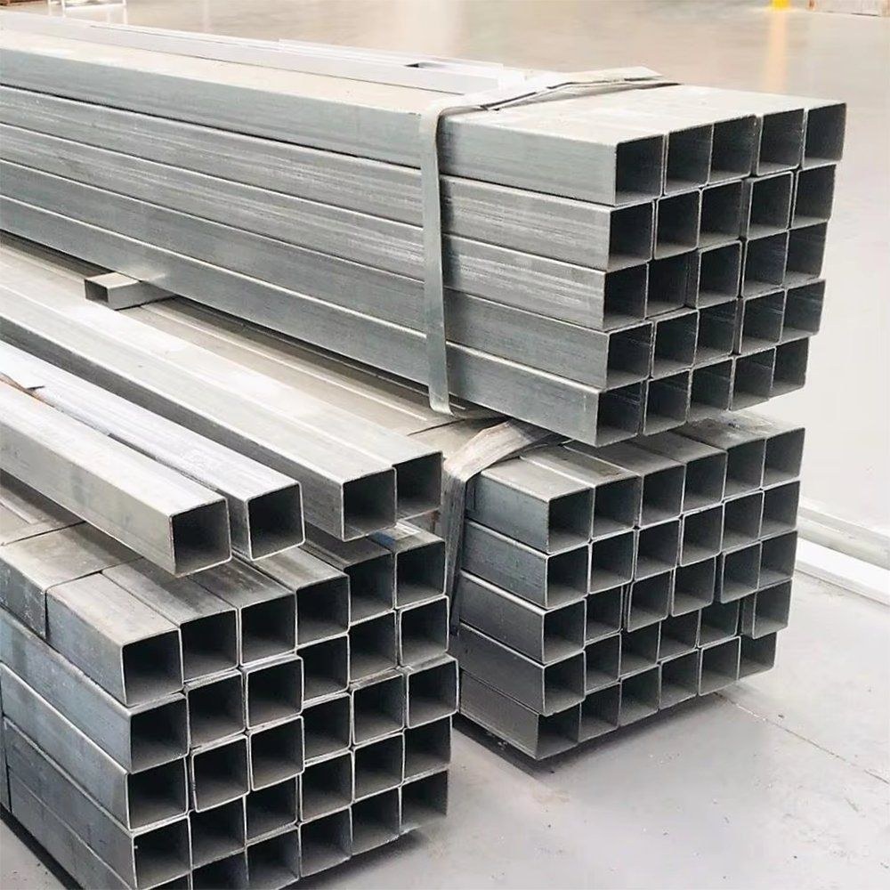 Stacks of square galvanized steel tubes in a warehouse