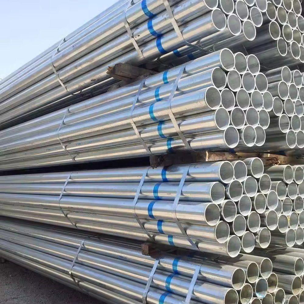 Bundles of galvanized pipe strapped with blue bands