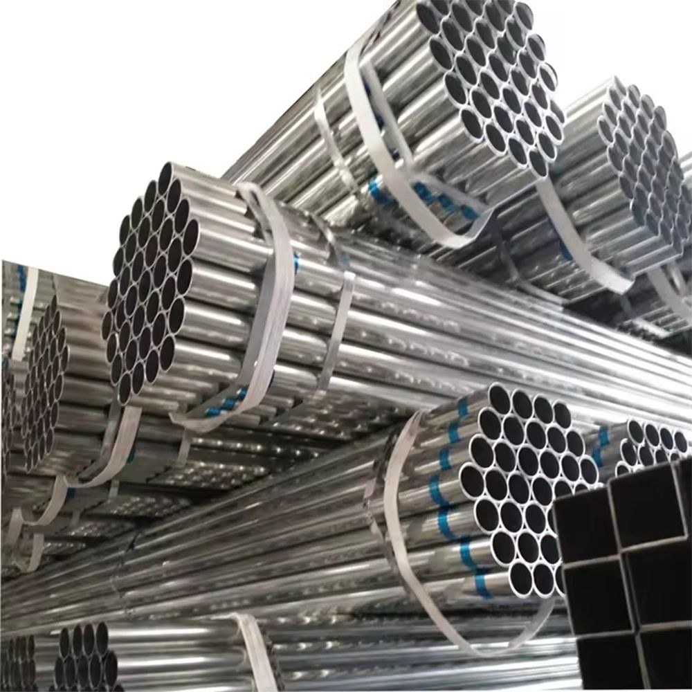 Galvanized pipe bundles stacked in a warehouse aisle