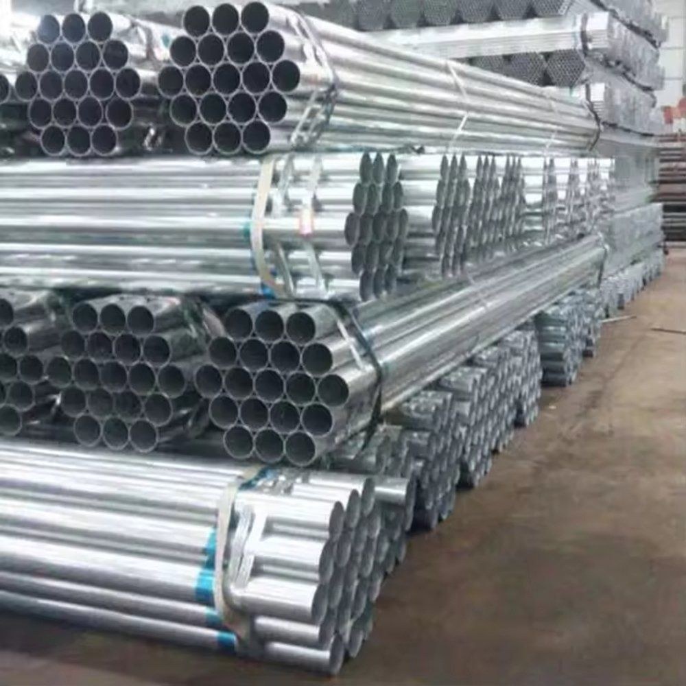 Stacks of galvanized steel pipe bundles in a warehouse