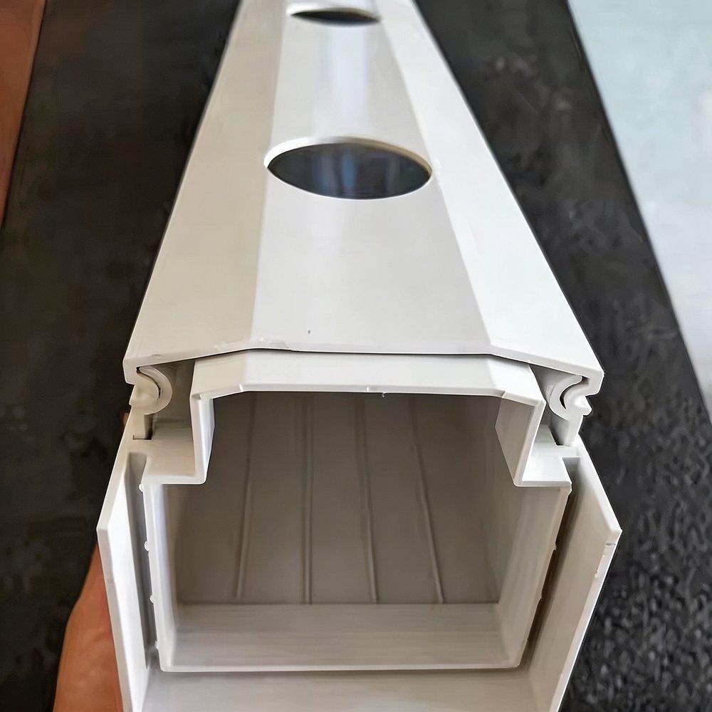 Close view of a white food grade PVC growing channel with a planting opening