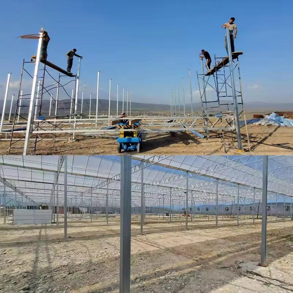 Greenhouse construction site with workers on ladders