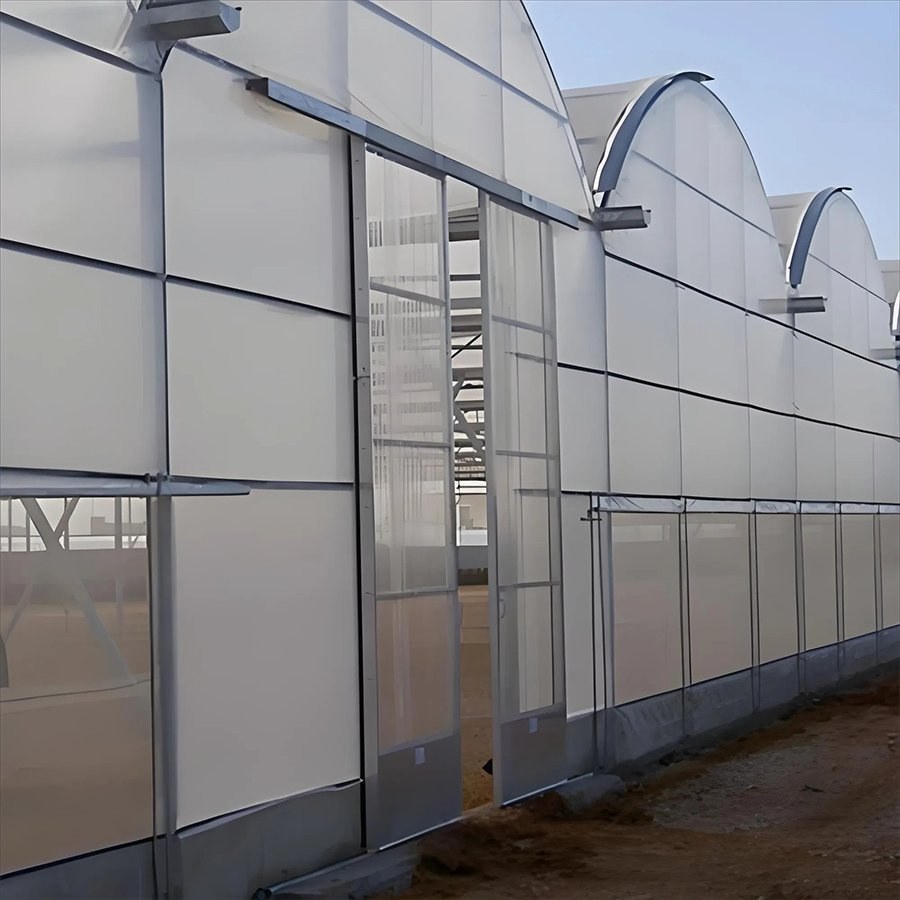 Greenhouse side wall with a personnel door and a film cover