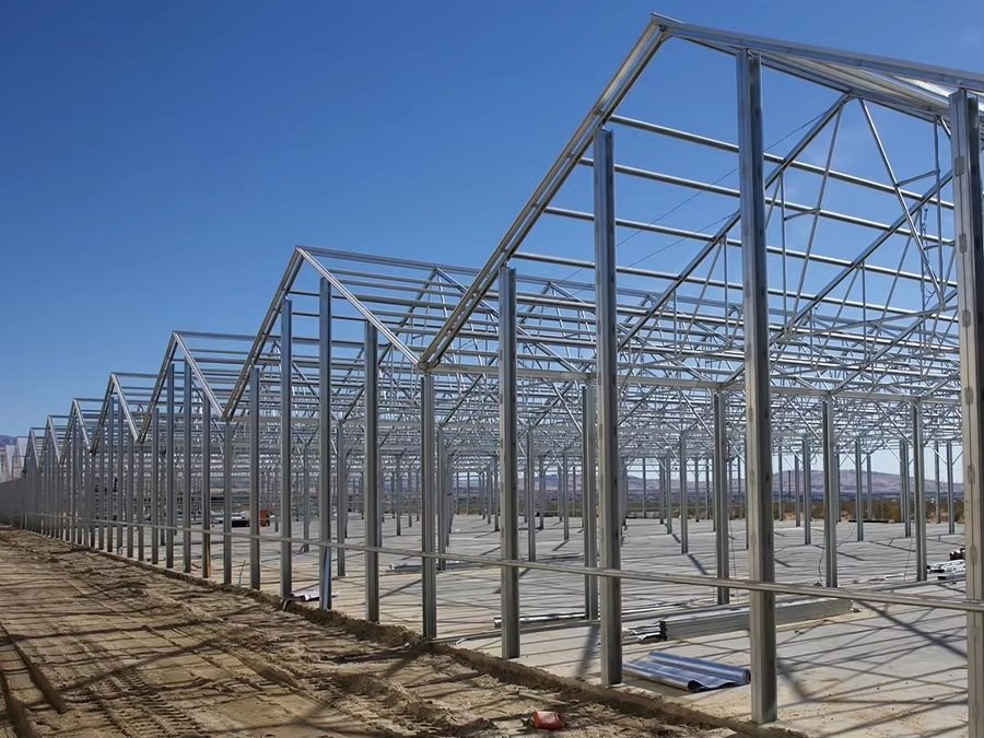 Steel greenhouse frame prepared to take polycarbonate glazing panels