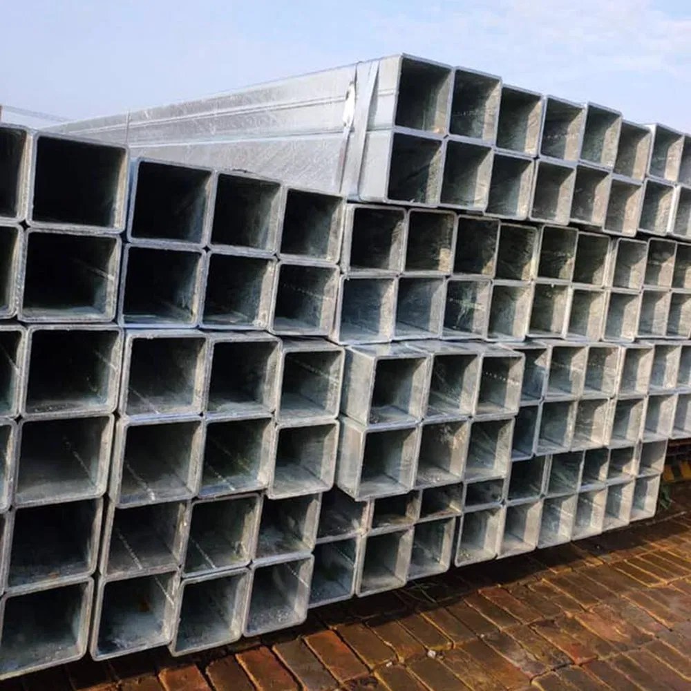 Stacks of galvanized square hollow sections for greenhouse frames on site